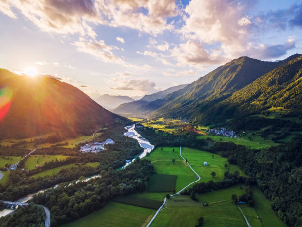 istock Sunset in Soca valley with blue river and mountains illuminated by evening sun 1340202847