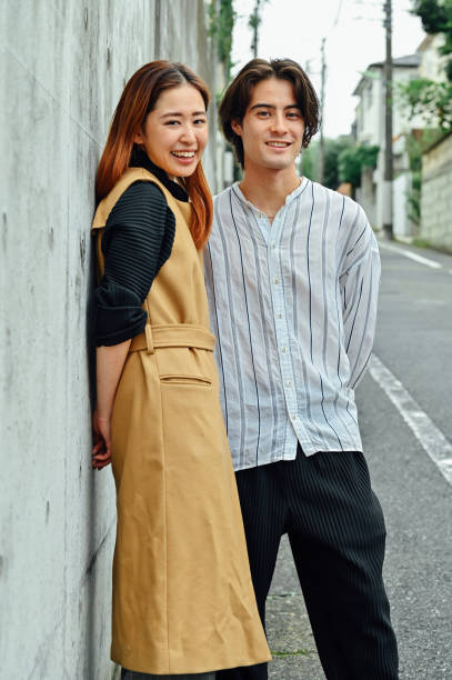 istock Young asian couple's portrait on a street 1340202898