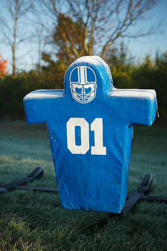 Blue and White Football Tackle Sled dawns a frosty over coat.  Fall weather says it's playoff time.  This sled is for the Hilliard Davidson team headed to state playoffs after an undefeated season.  Shot on a Canon 5D.