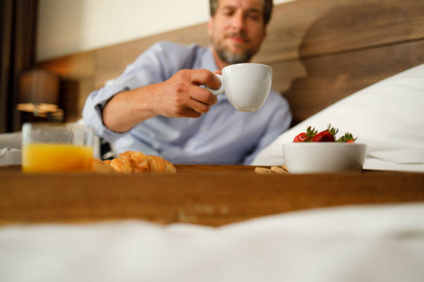 istock Close up of a man taking coffee cup from a tray. 1340203950