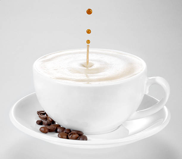 istock three coffee dops falling into a cup of cappuccino 134020584