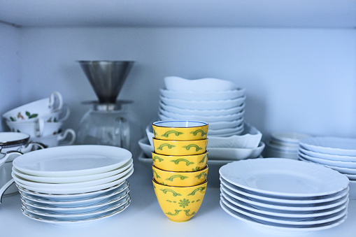 Tableware is lined up on the shelves.
