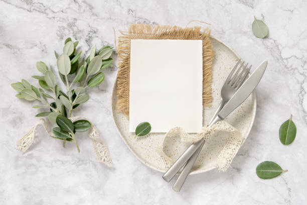 istock Blank paper card on a plate with eucalyptus branches and ribbons 1340211290