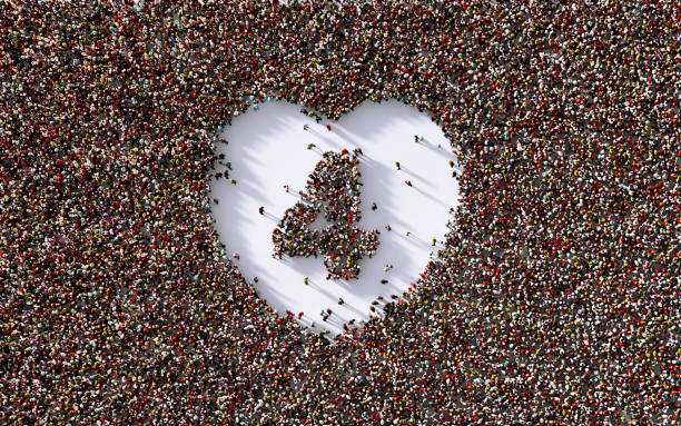 istock Human Crowd Forming Number Four Inside Of A Human Heart Shape 1340213768