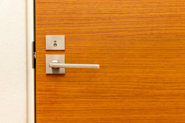 istock Wooden door with metal knob 1340213979