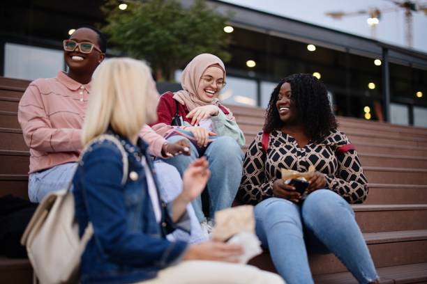 istock Friends sit on the dock and sing and have fun 1340214251