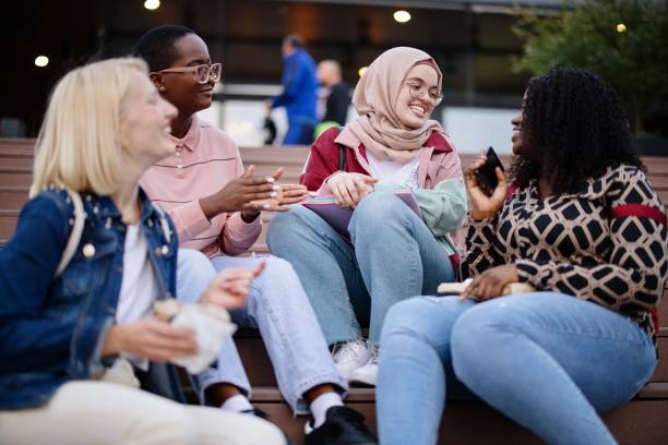 istock Friends sit on the dock and sing and have fun 1340214264