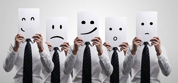 istock Five business men holding a card with emotional face. 134021433