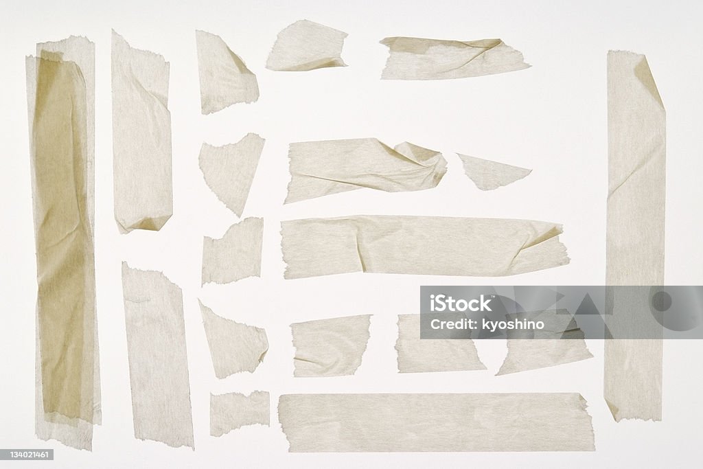 Isolated shot of torn adhesive masking tape on white background Different stripes of torn adhesive masking tape. All isolated white background. Adhesive Tape Stock Photo