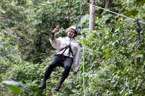 A Muslim man is enjoying extreme game - flying fox.