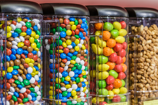 Colorful chocolate candy pills.Gumball machine filled with pills and drugs.Sweet food photo concept.