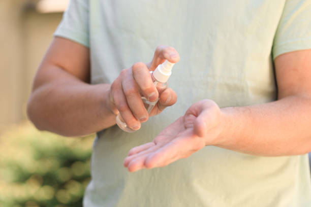 istock hand disinfection with an antiseptic spray as prevention of coronavirus 1340216824