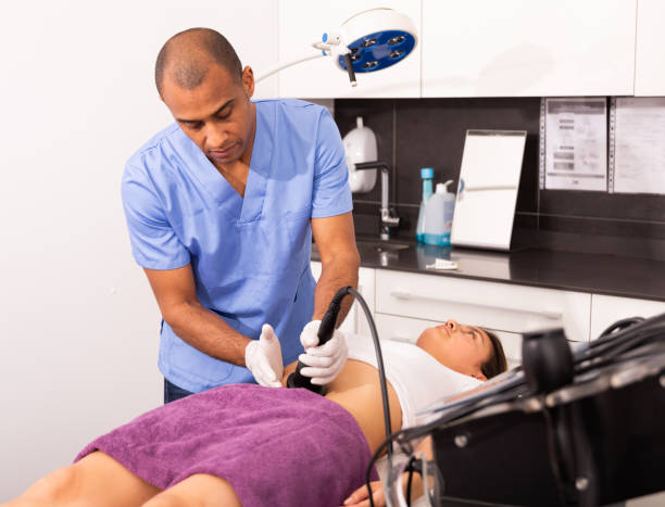 istock Beautician performing rf lifting procedure for female patient 1340218355