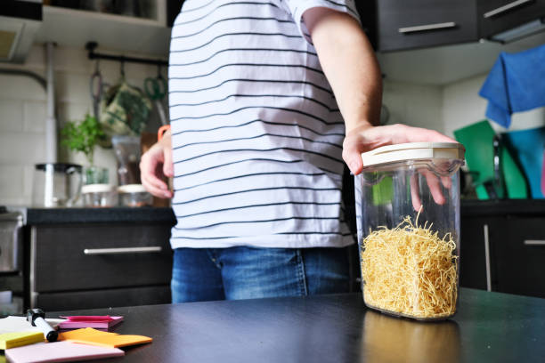 istock Woman is checking and organizing her kitchen pantry 1340220562