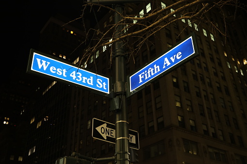 New York Manhattan Fifth avenue West 43rd street sign night