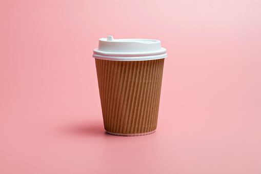 Paper Cup Against Pink Background