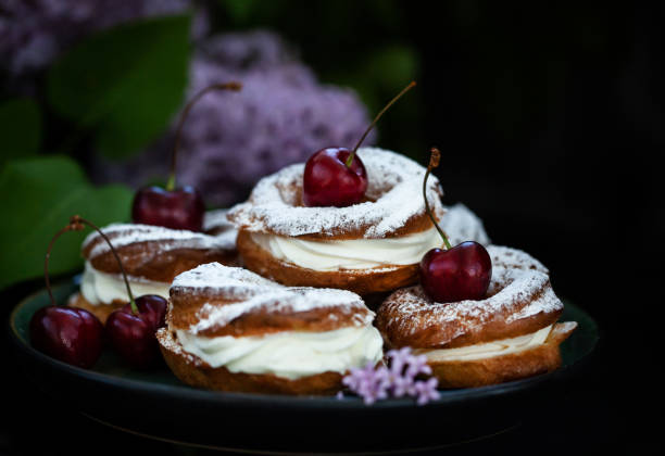 istock Cream puff rings decorated with fresh cherry 1340225172