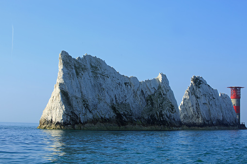 The Needles Lighthouse and Rocky Cliffs on The Isle of Wight, UK.