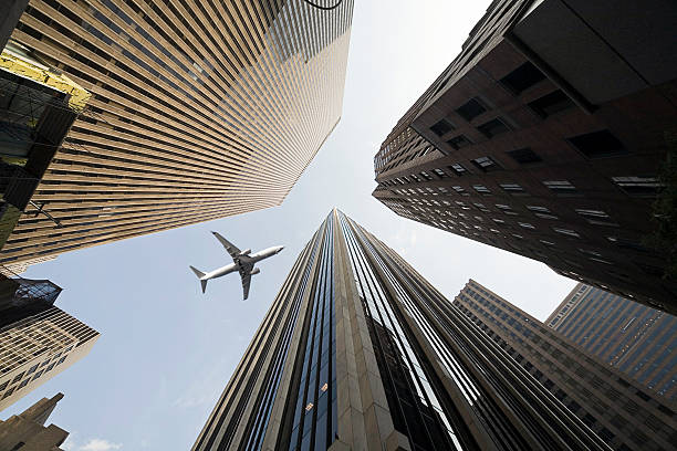 istock Business towers with a airplane 134023463