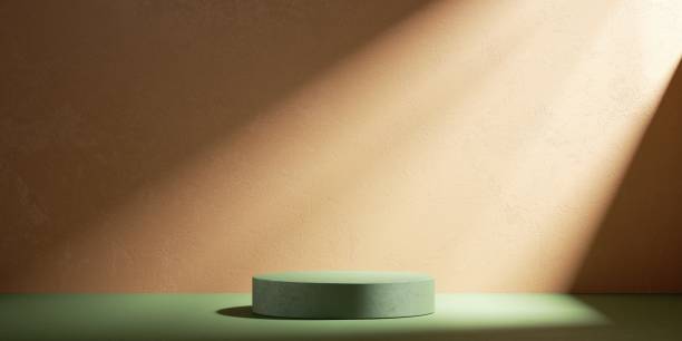 istock 3d render, abstract terracotta background with empty green podium for product presentation. Sunlight rays shining on the empty wall with stucco texture 1340236020