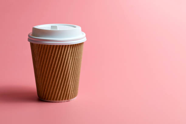 istock Paper Cup Against Pink Background 1340236498