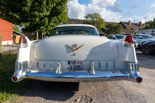 Winkel, Germany - September 11, 2021: old vintage cadillac car in white in use by a wedding rent a car company.