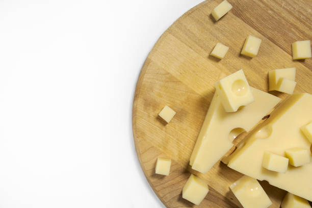 istock Sliced emmental cheese on a cutting board. Horizontally on a white background 1340238968