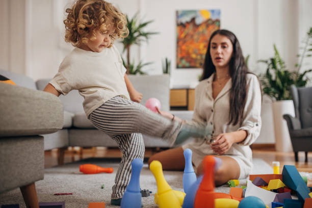 istock Mother and son playing with toys 1340238972