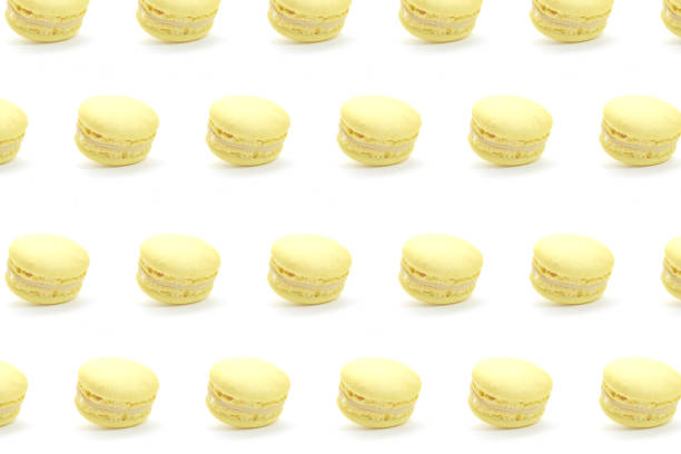 Yellow french macaroons isolated on white background. Nice pattern for your projects.
