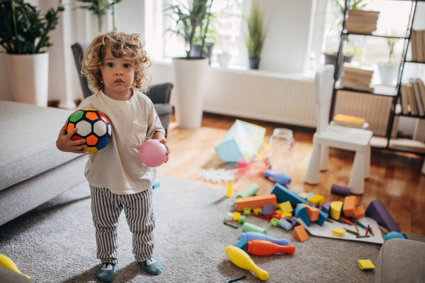 istock Little boy playing in living room 1340239218