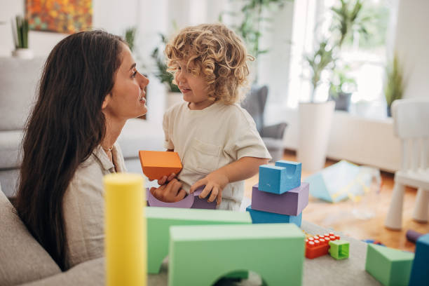 istock Little boy and mom playing on the sofa 1340240222