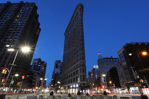 New York, USA - 04 05 2018: New York Manhattan Flatiron building tower night sunrise.