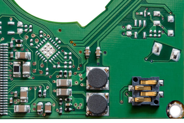 istock Local close-up of green mechanical hard disk circuit board 1340241831