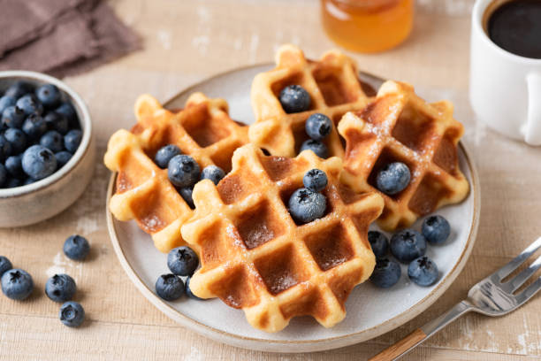 istock Belgian waffles with blueberries on plate 1340242702