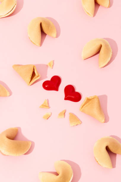 istock Creative composition with fortune cookies and hearts on pink background 1340242722