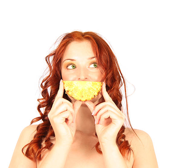 red-haired girl with funny pineapple smile isolated on white background