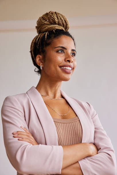 istock Young businesswoman thinking about work and smiling 1340246444