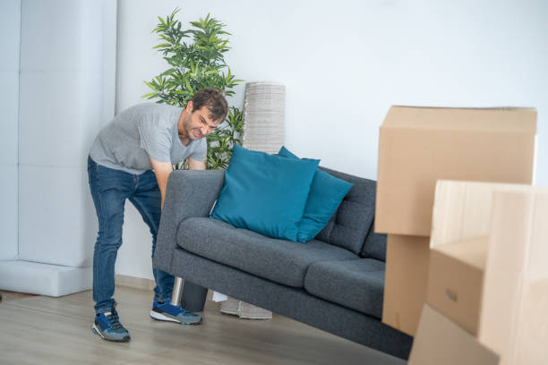 istock One man moving into new home and suffering from back pain 1340250270