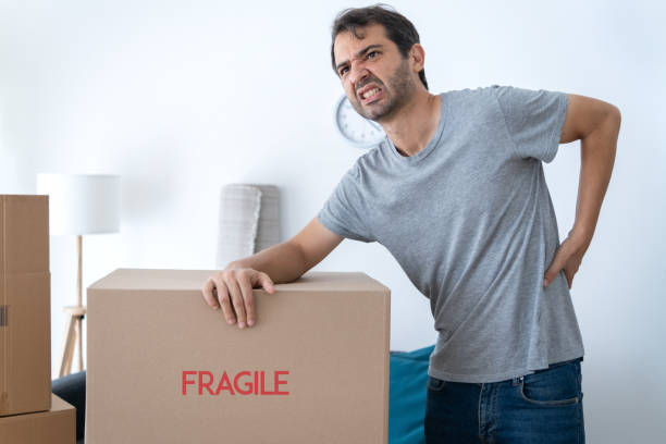 istock One man moving into new home and suffering from back pain 1340250707