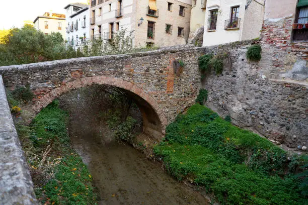 Darro carrera street river and arch in Granada of Spain at Andalusia