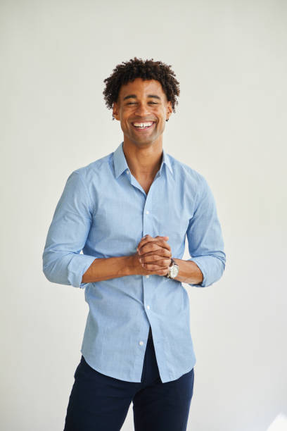 istock Casual young businessman laughing against a white background 1340252352