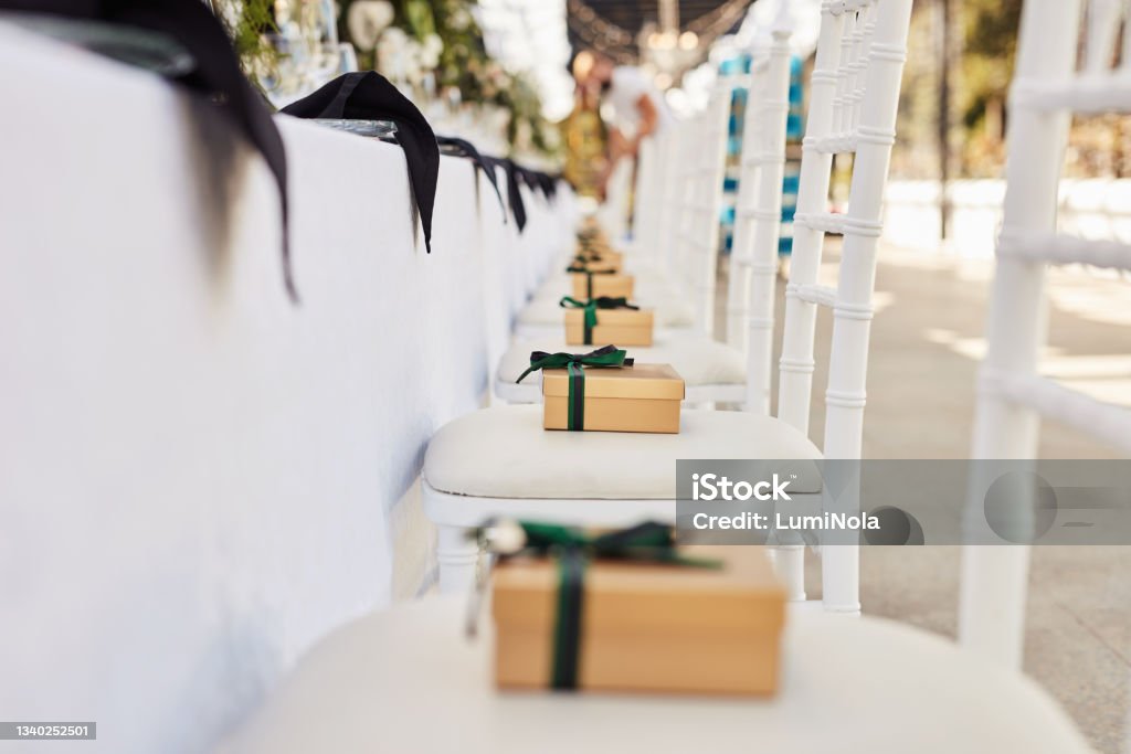 Shot of a gift box on a chair at a wedding reception Precious mementos, priceless memories Wedding Stock Photo