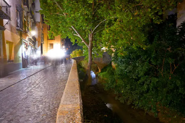 Darro carrera street river and arch in Granada of Spain at Andalusia