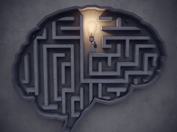 istock Big Idea Concept, The man turns on the lightbulb in the maze-shaped brain 1340257497