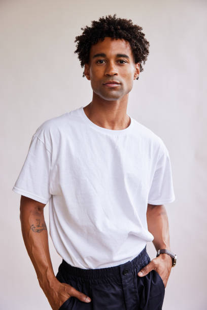 istock Confident young man standing with his hands in his pockets 1340257746