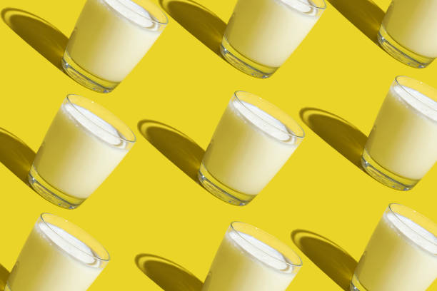 istock World Milk Day. Pattern on a yellow background. A glass of milk. Sample. 1340257868