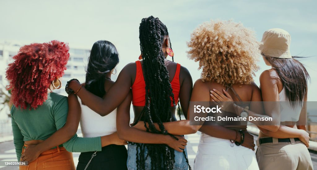 Shot of a group of unrecognizable girl friends in the city Beautiful women help lift each other up Women Stock Photo