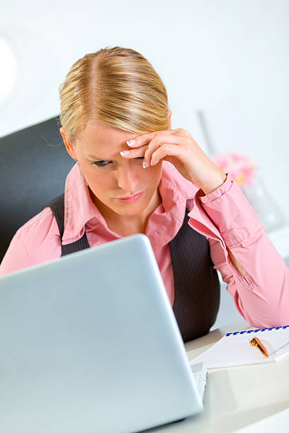 istock Concerned business woman working on laptop at office 134026136