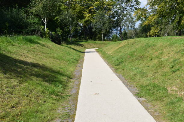istock straight way in a park, lower than grass level around 1340262299