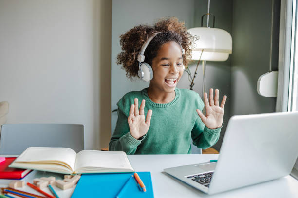 istock Little girl communicates on a video call with teacher 1340262637